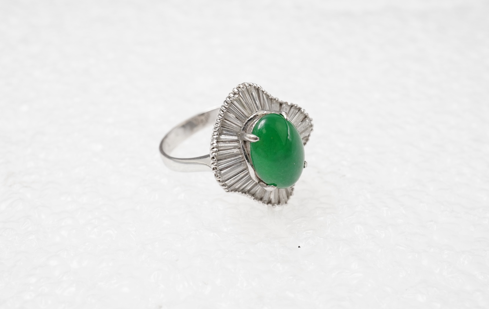 A fine jadeite and diamond ring